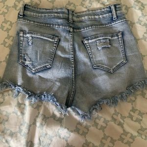 Distressed light blue fraid jean shorts